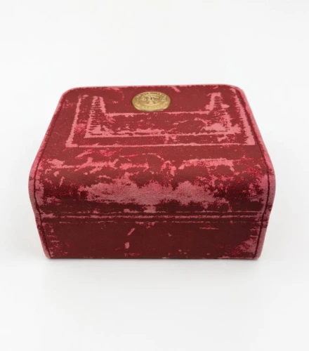 Omega red leather Watch box Circa 2000s gold colour medallion